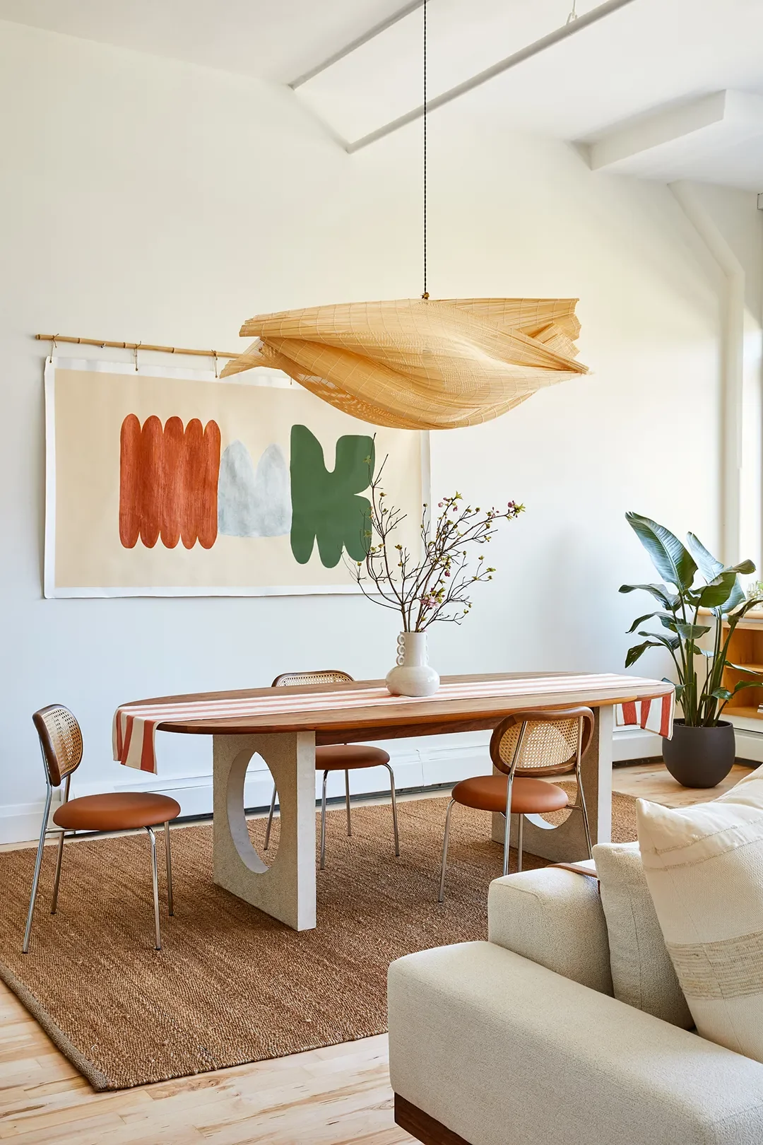 Madera Dining Table,Yucca Stuff; Perch Chairs,Industry West; Canvas Art byVirginie Hucher; Closed Pendant,Jake Coan Design. Photography by Sean Litchfield
