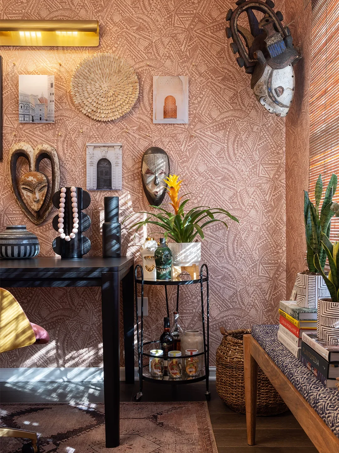 vintage masks and art on galler ywall