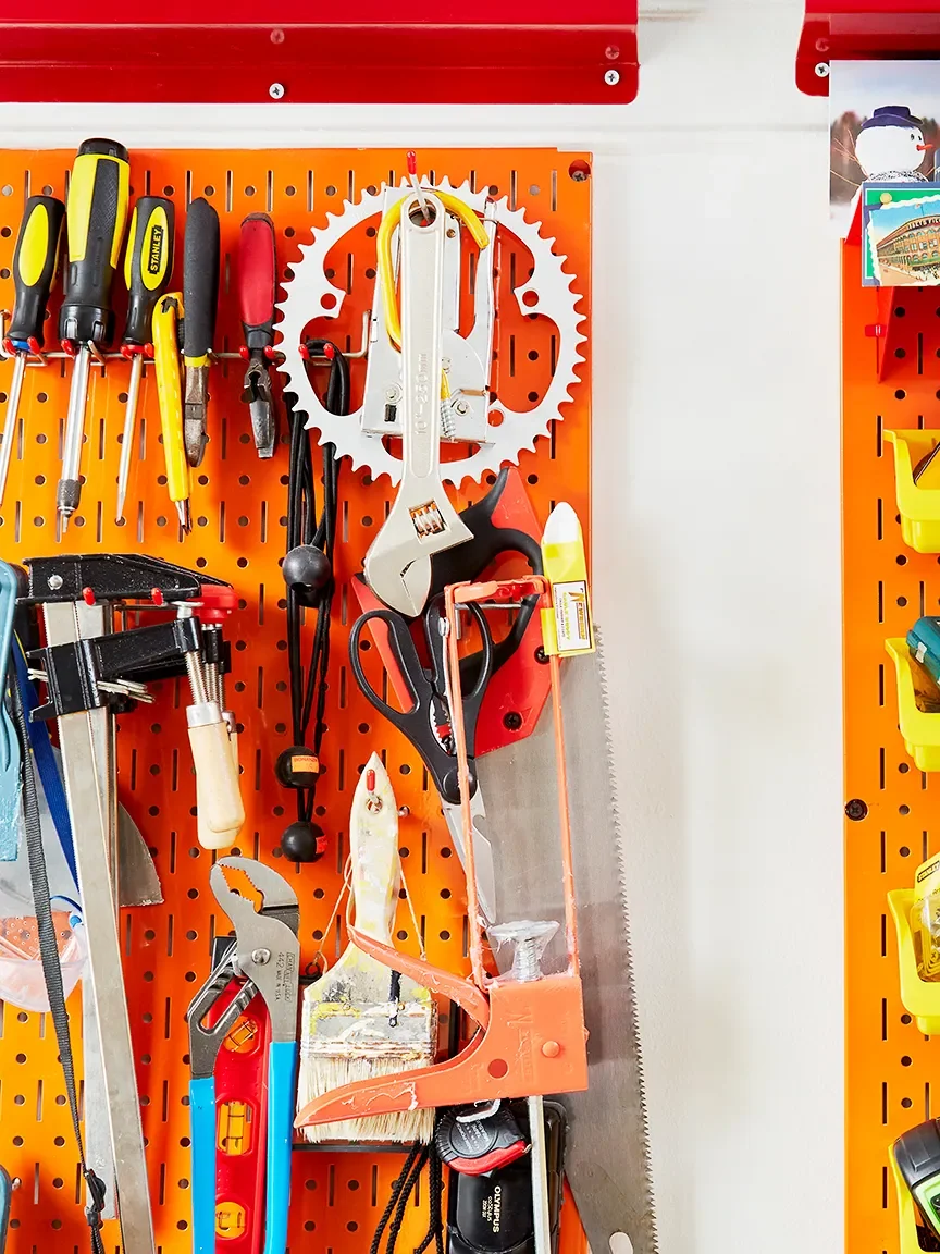 Orange pegboard holding tools
